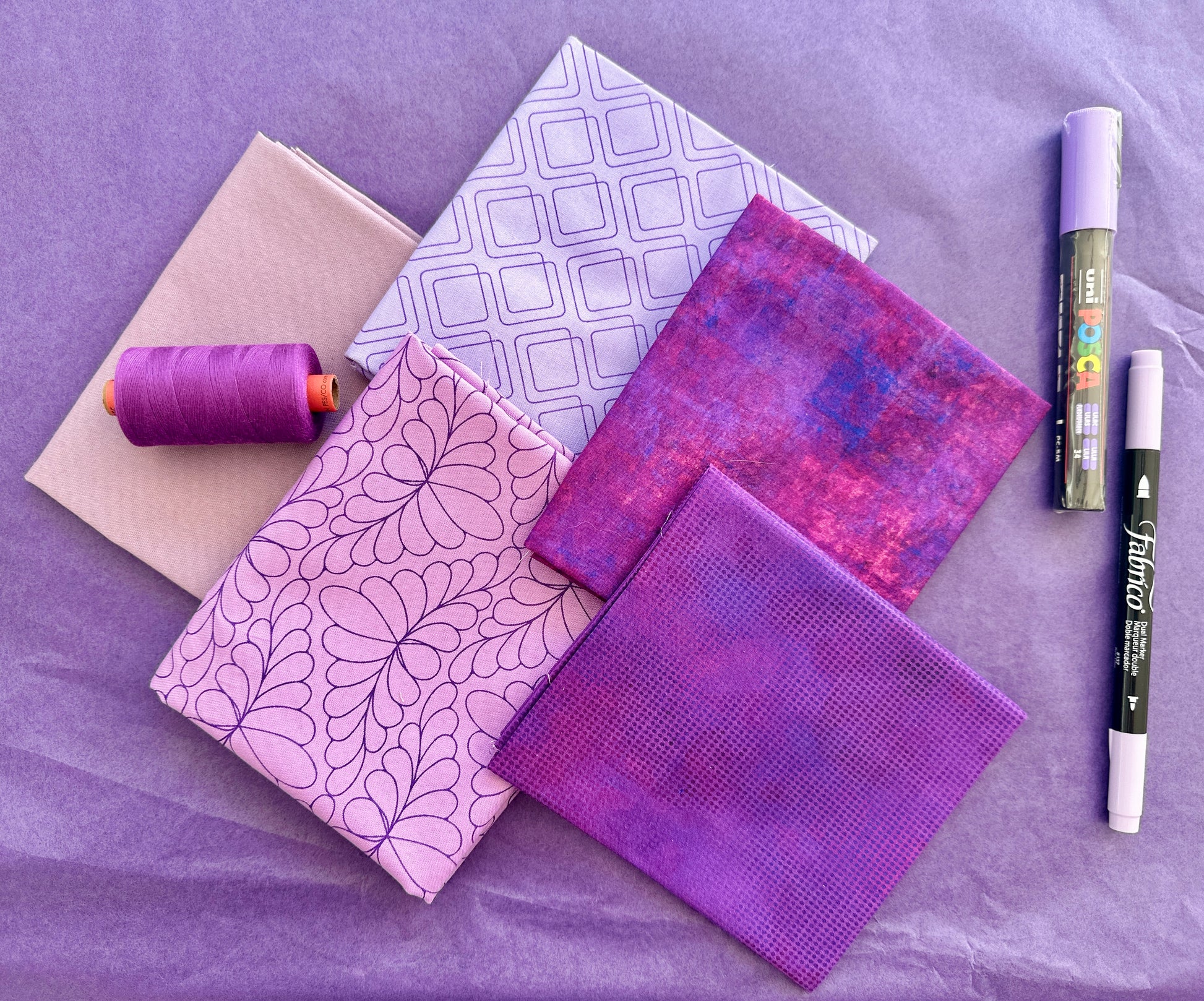 Purple mauve rainbow stash builder bundles of quilting fabric in fat quarters with a Posca pen and Fabrico pen and rasant thread available at 2 sew textiles art quilt supplies