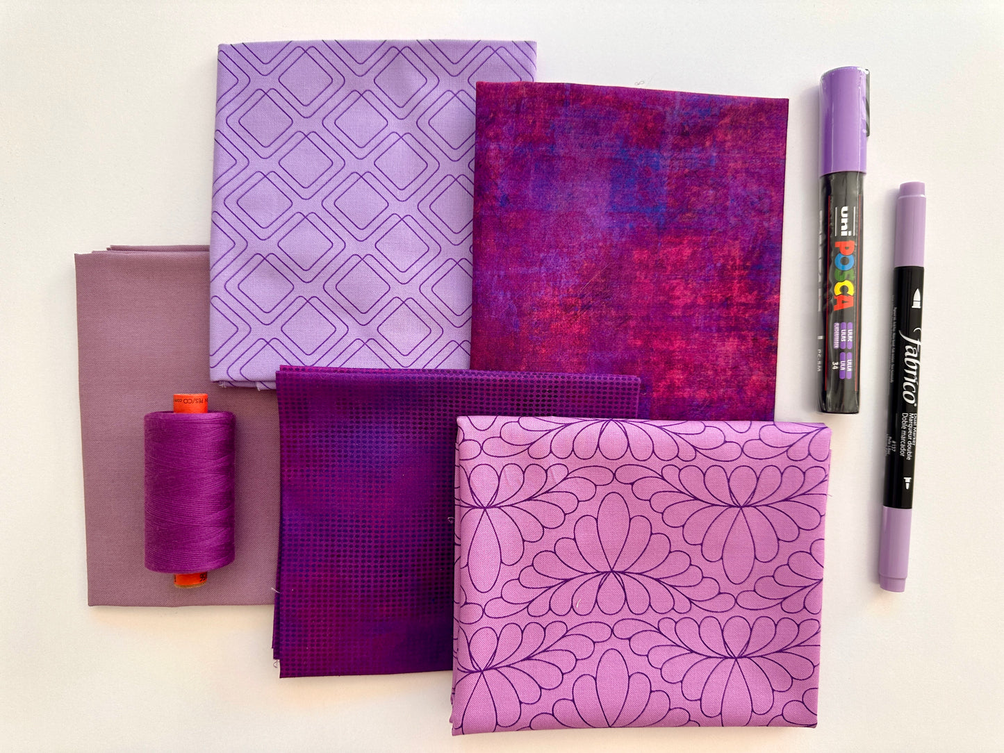 Blue rainbow stash builder bundles of quilting fabric in fat quarters with a Posca pen and Fabrico pen and rasant thread available at 2 sew textiles art quilt supplies