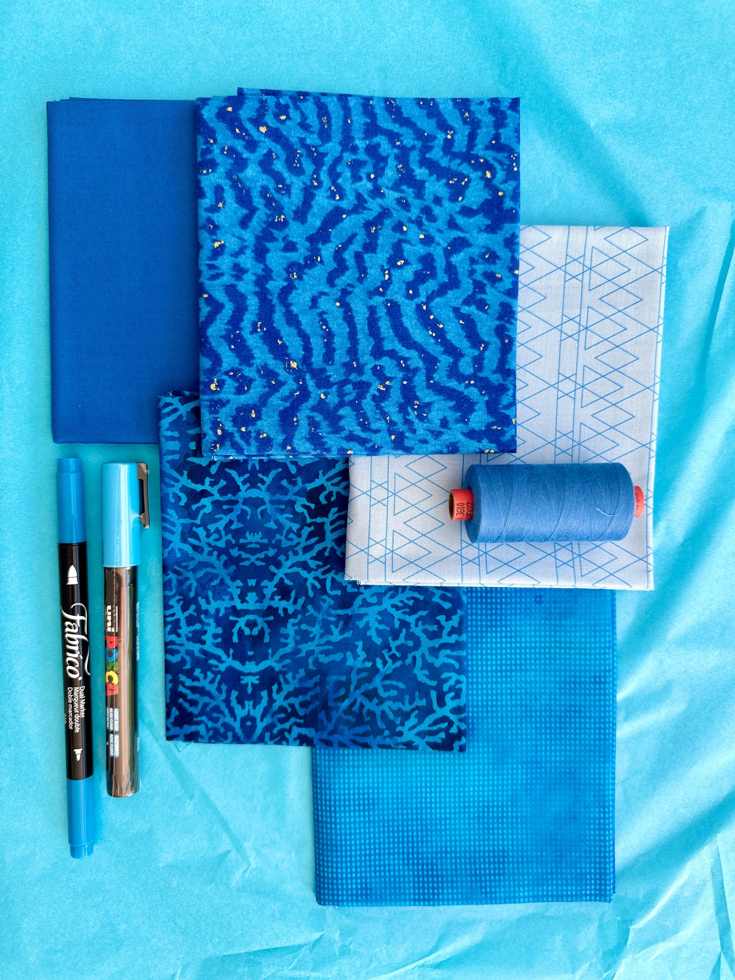 Blue rainbow stash builder bundles of quilting fabric in fat quarters with a Posca pen and Fabrico pen and rasant thread available at 2 sew textiles art quilt supplies