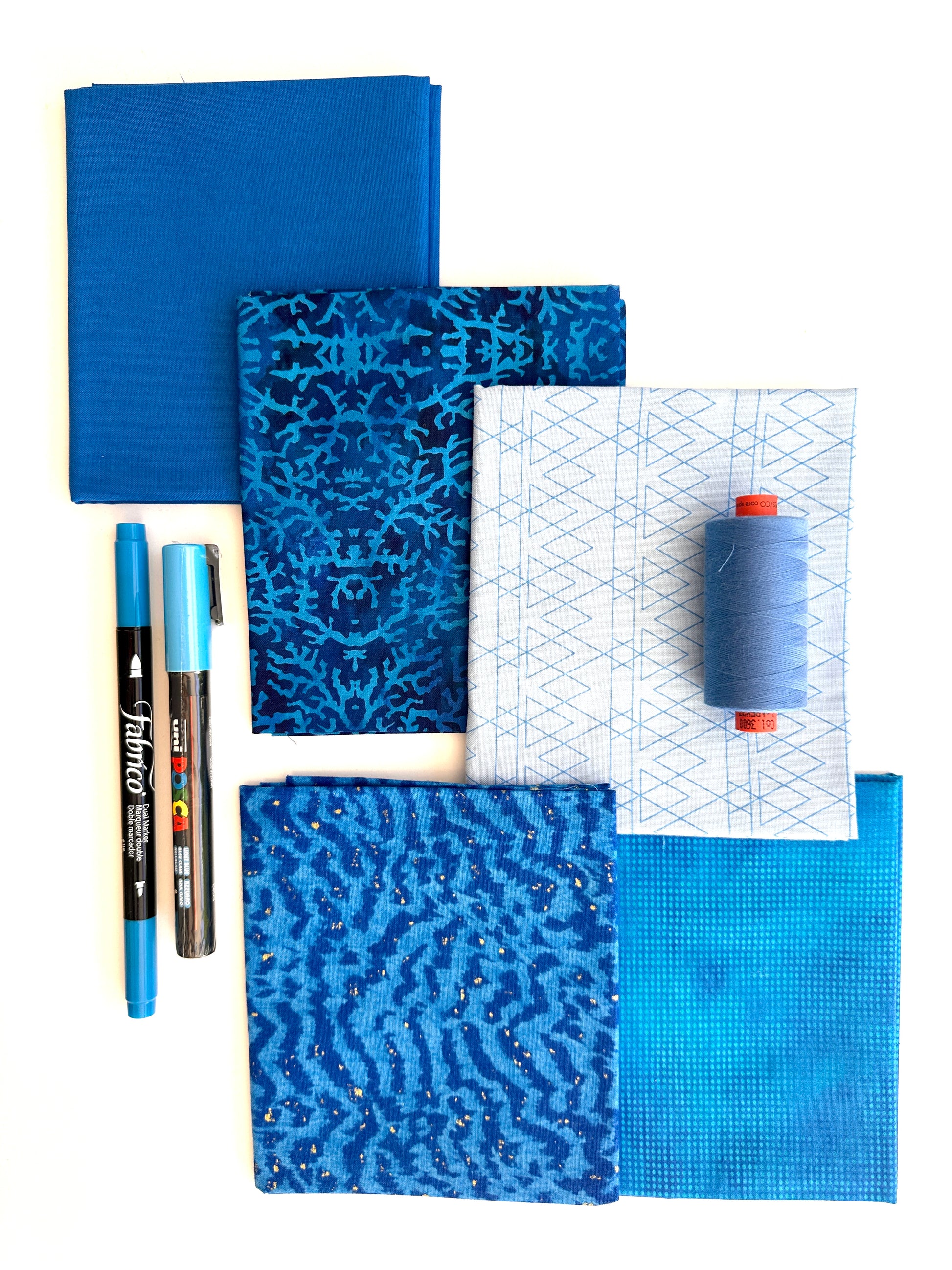 Blue rainbow stash builder bundles of quilting fabric in fat quarters with a Posca pen and Fabrico pen and rasant thread available at 2 sew textiles art quilt supplies