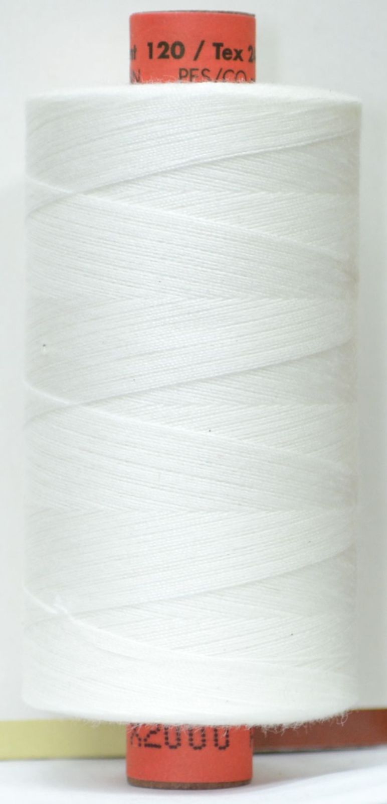 x2000 Large spool of white thread with red labels on a white background available at 2 sew textiles art quilt supplies