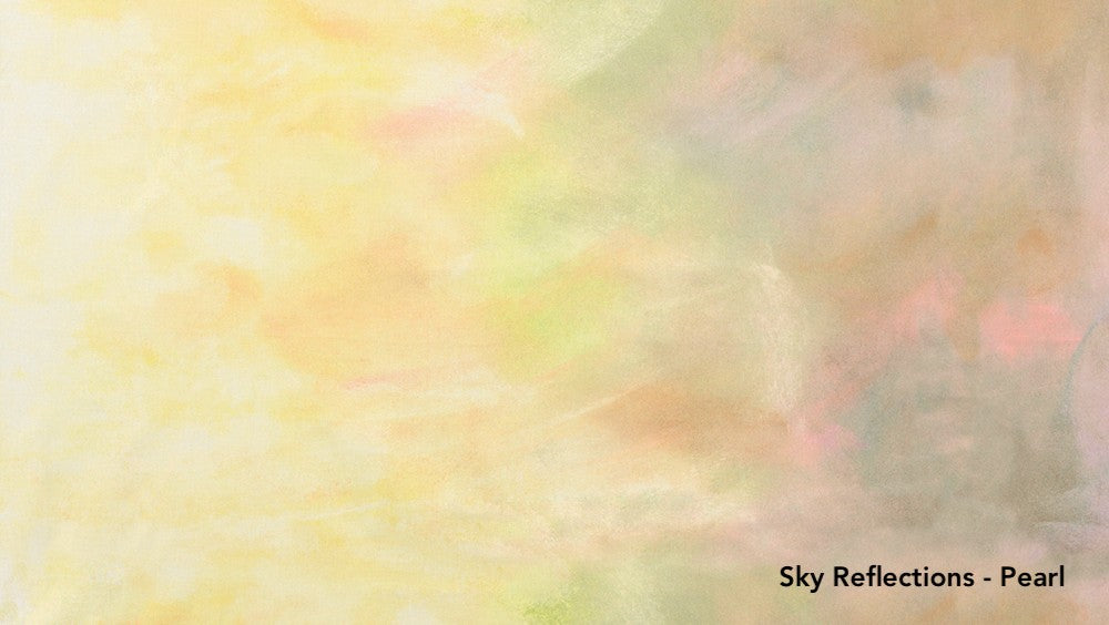 Textured fabric with 'Sky Reflections - Pearl' label on a yellow and pink gradient background