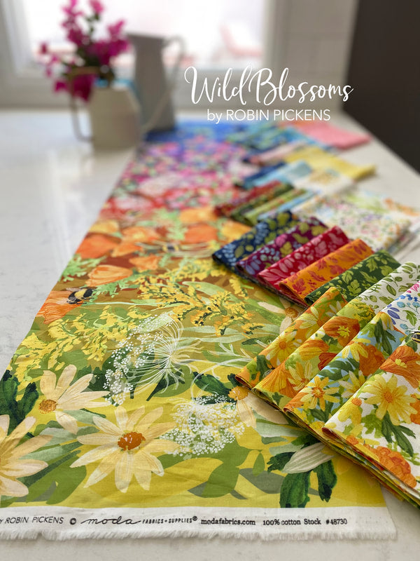 Promo Image Wild Blossoms with a rainbow of colour, bees and flowers and foliage across the width.  By Robin Pickens for Moda Fabric at 2 Sew Textiles Art Quilt Supplies