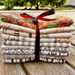 Bundle of 9 metric fat quarters of Tim Hoktz fabrics tied with a ribbon at 2 sew textiles art quilt supplies