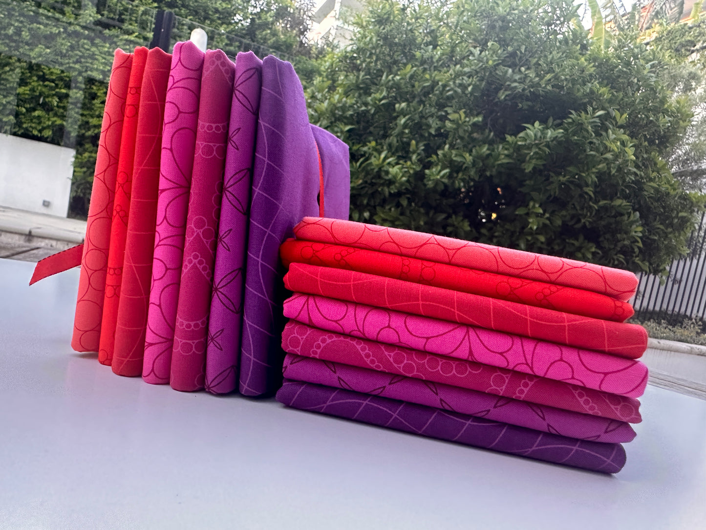 Spring plums reds pinks purples bundles Half metre bundles of delicious Rainbow Spice quilt fabrics by Sarah Thomas - Sariditty for moda.  Available at 2 sew textiles art quilt supplies